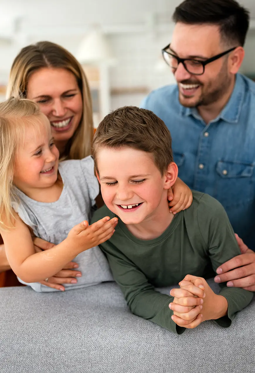 happy family smiling and laughing together at home