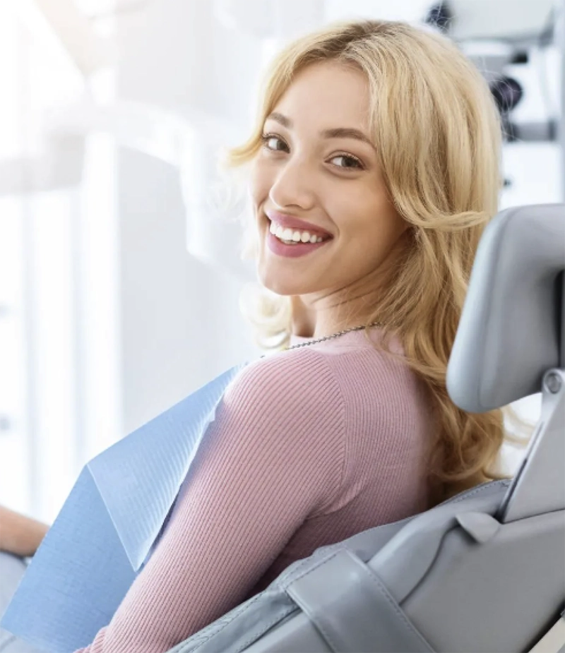 smiling woman in dentist chair