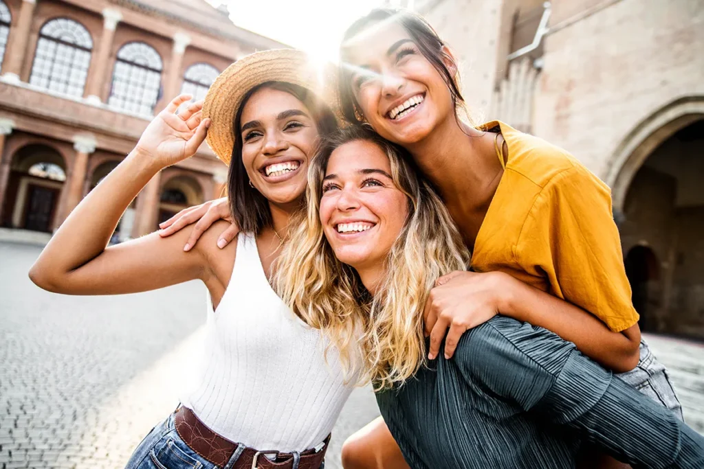 three-young-diverse-women-having-fun-on-city-street